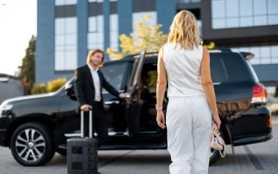 elegant-business-woman-white-casual-clothes-walks-luxury-car-man-with-suitcase-opens-vehicle-door-having-business-trip-together_506452-2169